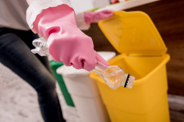 istock Young girl sorting garbage at the kitchen. Concept of recycling. Zero waste 1208155814