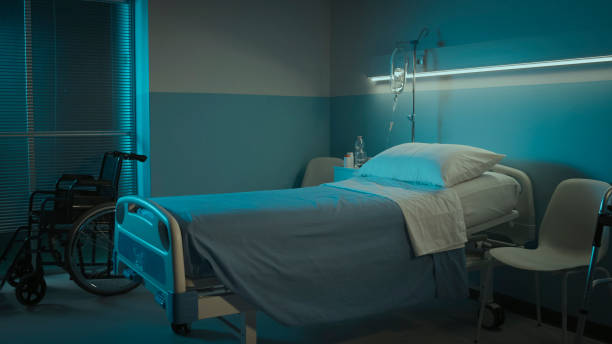 istock Clean hospital room interior at night 1208155819