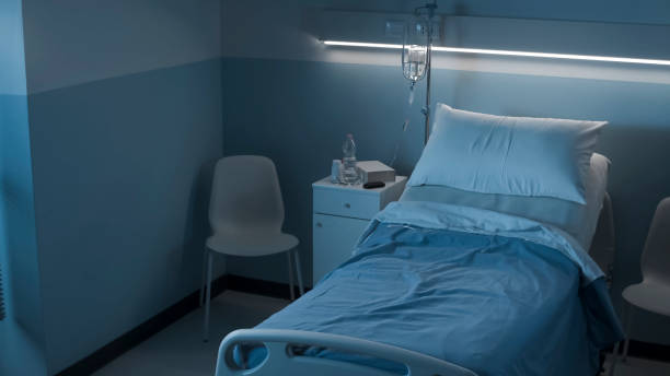 Clean hospital room interior at night Clean hospital room interior at night with bed and medical equipment, medicine and healthcare concept night hospital bed stock pictures, royalty-free photos & images