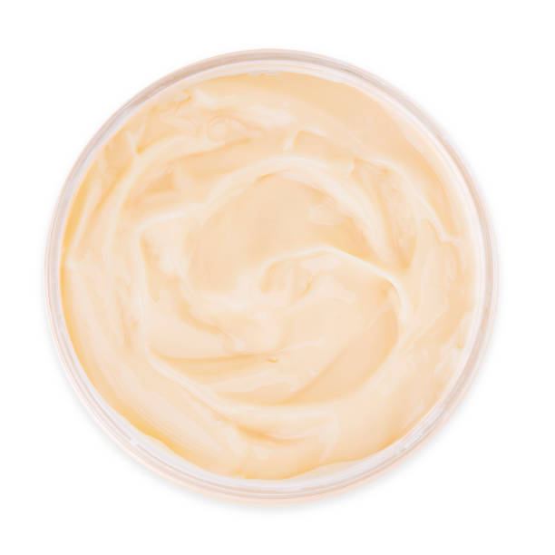 istock Jar of yellow cream isolated on white background, top view 1208156061