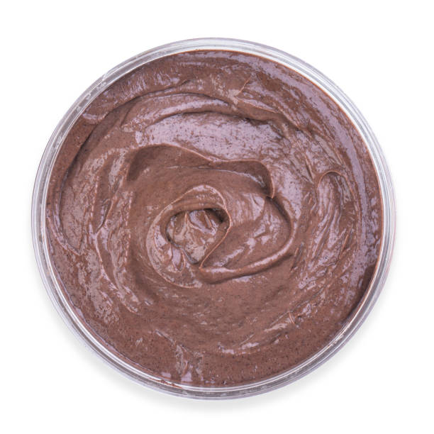 istock Jar of chocolate cream isolated on white background, top view 1208156079