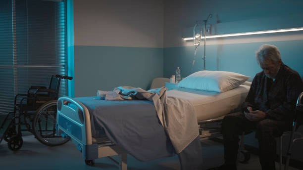 istock Lonely senior at the hospital making a phone call 1208156218