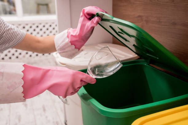 istock Young girl sorting garbage at the kitchen. Concept of recycling. Zero waste 1208158451