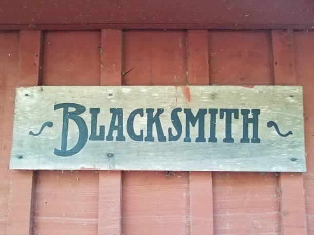 istock wood blacksmith sign on dirty red wall 1208163623