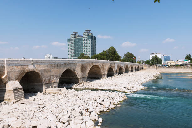 Hilton SA hotel at Adana Turkey with the Historical Stone bridge. Adana, Turkey - June  27, 2019: Hilton SA hotel at Adana Turkey with the Historical Stone bridge. hultonarchive stock pictures, royalty-free photos & images