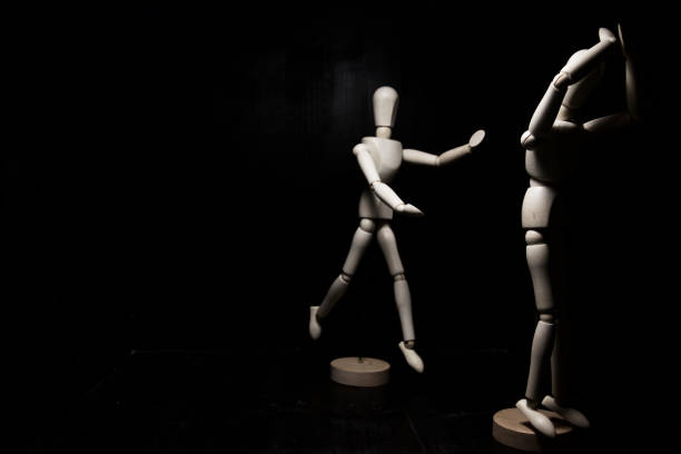 istock A mannequin in despair and another one running to help 1208165901