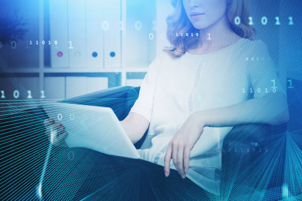 istock Woman with laptop in office, network interface 1208166524