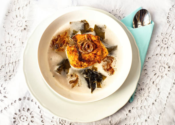 istock Fish soup with roasted fish, seaweed and onion circles. 1208166798