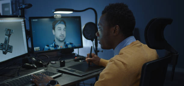 istock Graphic designers discussing via a video call 1208167333