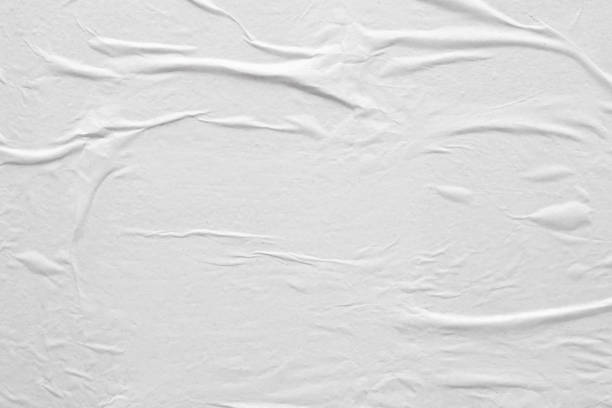 istock Blank white crumpled and creased paper poster texture background 1208171690