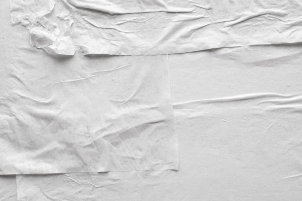 istock Blank white crumpled and creased paper poster texture background 1208171693