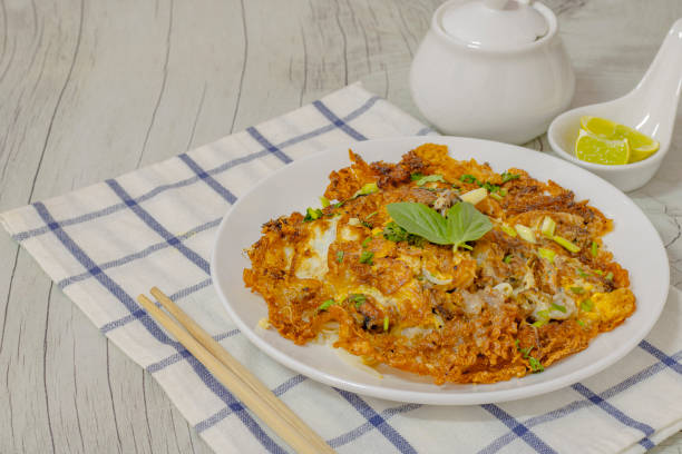 istock Deep-fried clams mixed with a paste on a white plate. Thai food. 1208171871