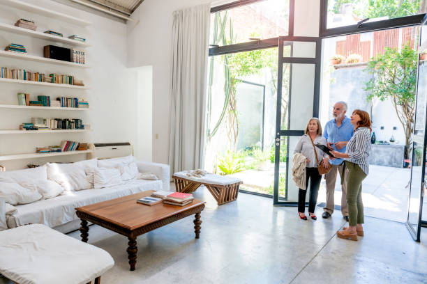 istock Real estate agent showing the house 1208173805