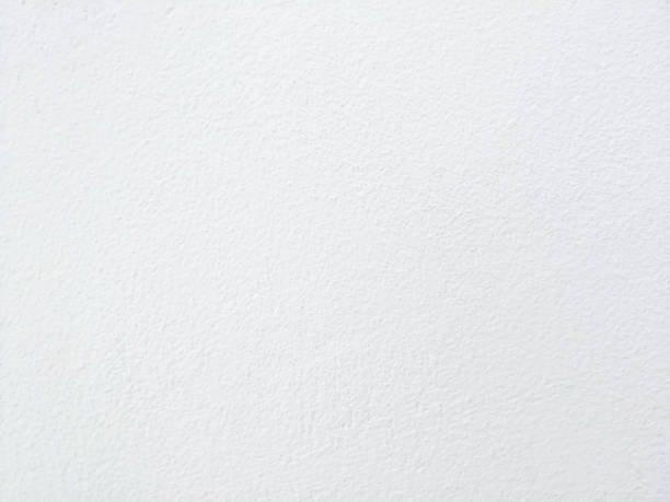 istock White concrete wall texture background and look like paper texture. 1208174245
