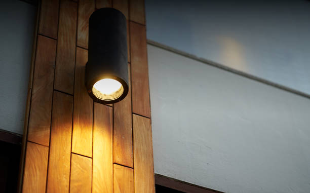 lamp on wooden tile decoration pole with turn on light in dark time stock photo
