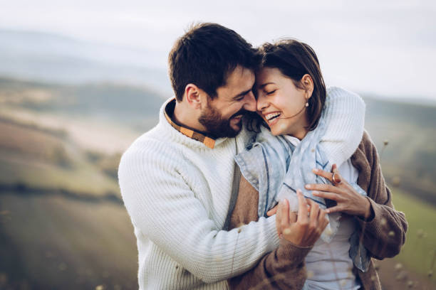 istock Young happy couple embracing with great affection in nature. 1208175761