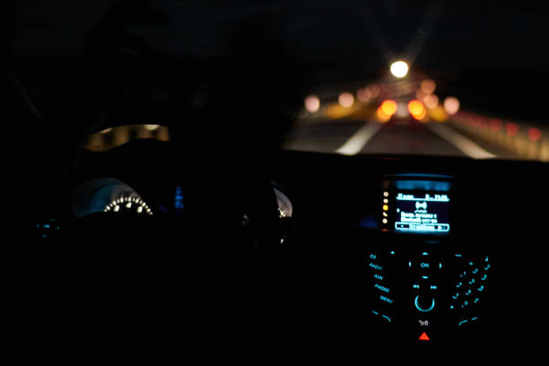 istock Driving a car, night highway 1208176815