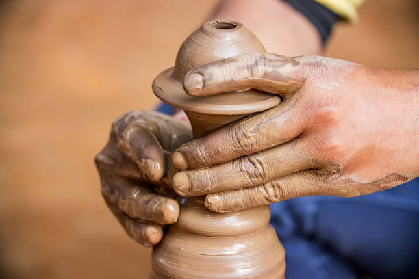 istock Potter at work makes ceramic dishes. India, Rajasthan. 1208177921
