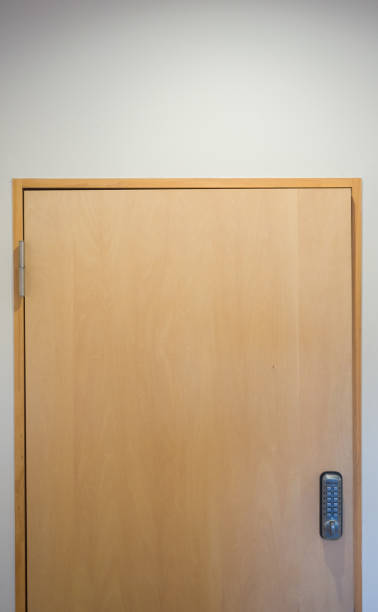 istock Minimalist brown wooden door 1208179268