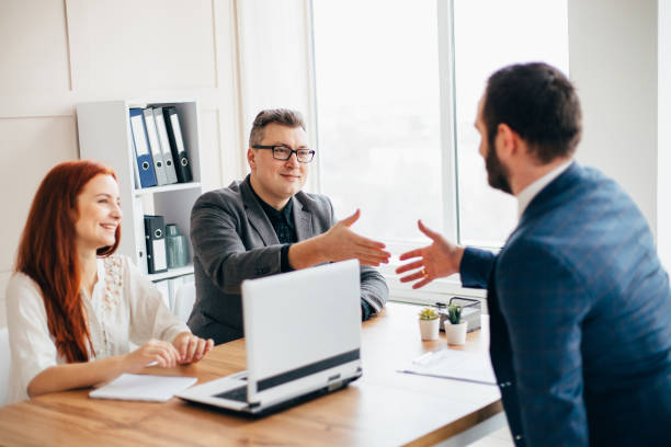 istock Business partners handshaking after deal 1208179362