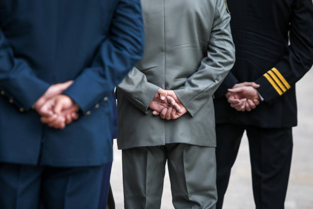 istock Details with Romanian army veterans holding their hands at their backs. 1208179682