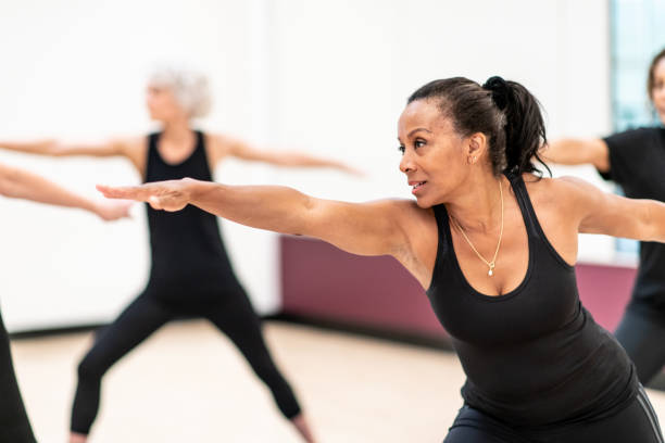 istock Women's Yoga Class stock photo 1208181281