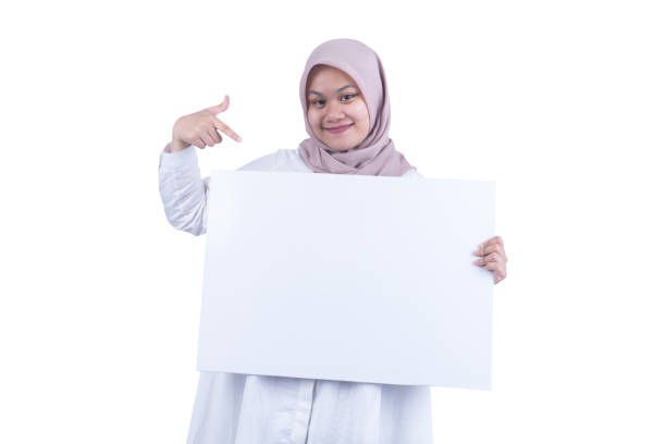 istock Southeast Asian Muslim Woman with White Board - Copy Space 1208181402