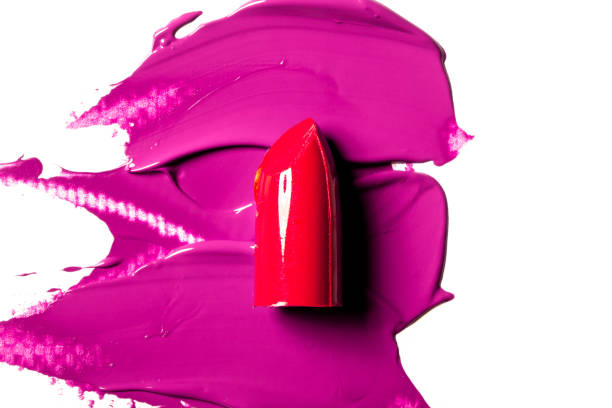 Beautiful photo of red lipstick, texture of red lipstick on a white background close-up.