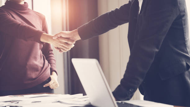 istock Business executives join hands to success 1208186002