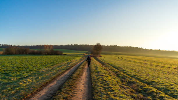 istock People running on a straight path in the morning 1208186821