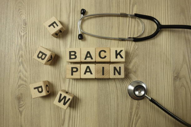istock Text back pain from wooden blocks with stethoscope 1208186862