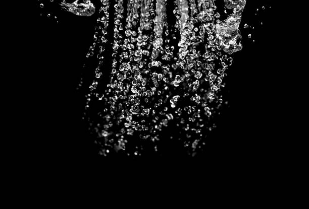 istock water splash isolated on black background 1208187344