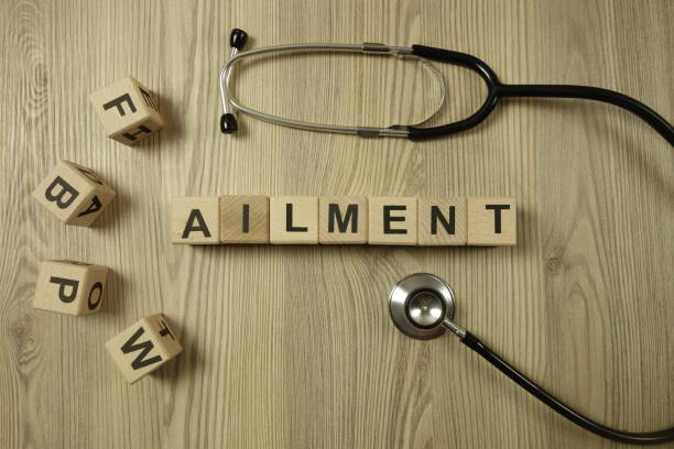 istock Word ailment from wooden blocks with stethoscope 1208188264