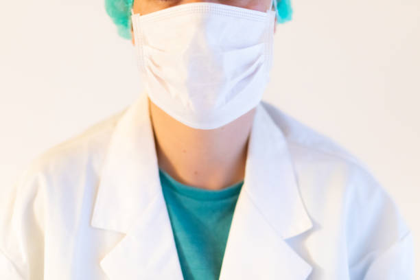 Female healthcare professional (doctor/surgeon/nurse) half-face closeup with copyspace