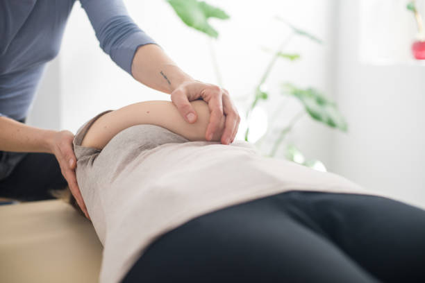 istock Woman practicing Somatic movement in her Health Studio, Awareness through movement, embodiment and Feldenkrais Method 1208188457