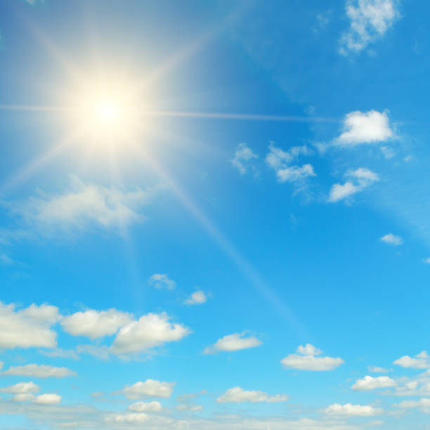 istock Couds in the blue sky. Bright midday sun illuminates the space. 1208193655