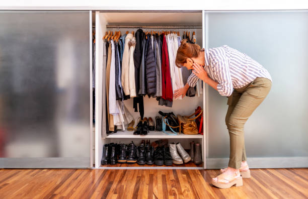 istock Senior woman packing luggage 1208194019