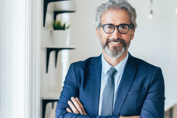 istock Confident and smiling businessman 1208195017