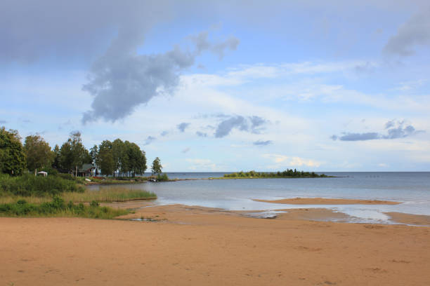 istock Empty sand beach at the shore of Lake Vanern, Sweden. 1208196645