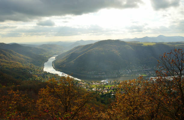 istock river valley with cloudy sky and sunbeam 1208199508