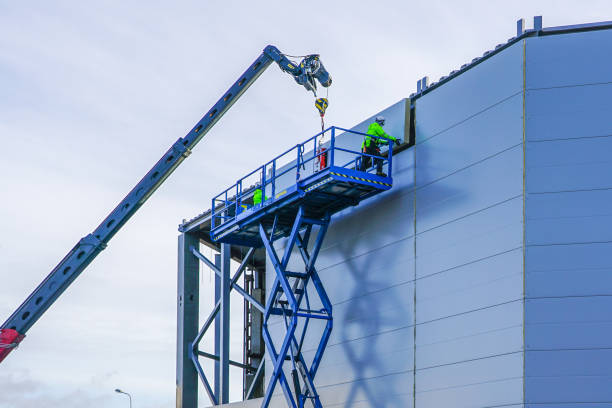 sandwich panels wall mounting using crane and scissor lift steel sandwich panels wall mounting using crane and scissor lift sandwich panel photos stock pictures, royalty-free photos & images