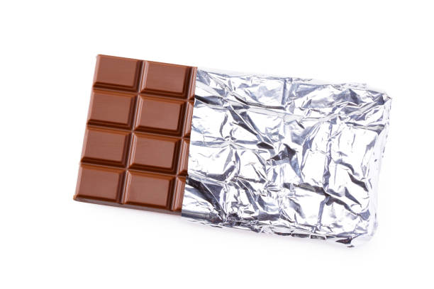 istock milk chocolate bar in foil isolated on white background. top view 1208202822