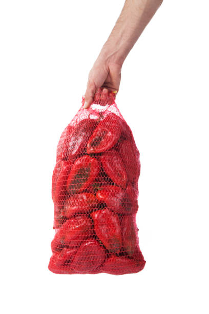 istock Red bell pepper in bag isolated on white background 1208203188