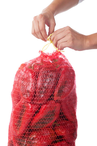 istock Red bell pepper in bag isolated on white background 1208203195