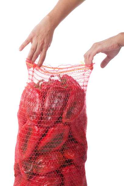 istock Red bell pepper in bag isolated on white background 1208203216