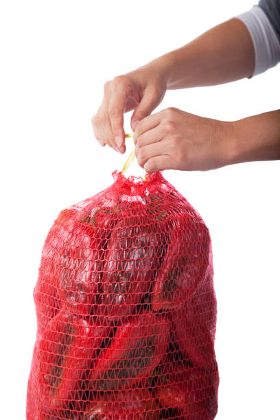 istock Red bell pepper in bag isolated on white background 1208203244