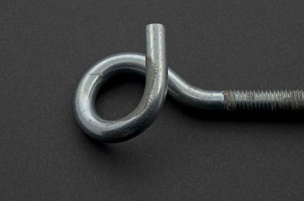 istock Steel pigtail screw hook on black background. 1208204224