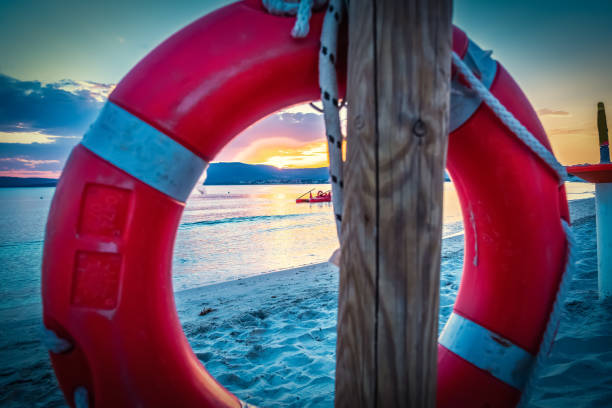 istock Life buoy by the sea in Alghero shore at sunset 1208204292