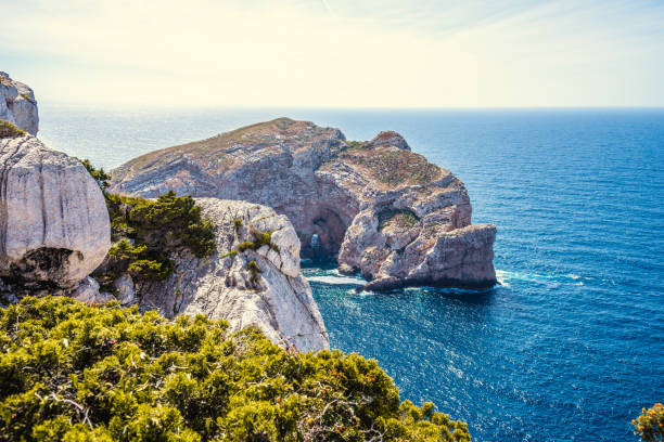 istock Foradada island and Capo Caccia cliff on a clear day in the springtime 1208205335