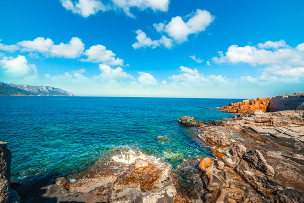 istock Cloudy sky over Rocce Rosse shore in Sardinia 1208205696